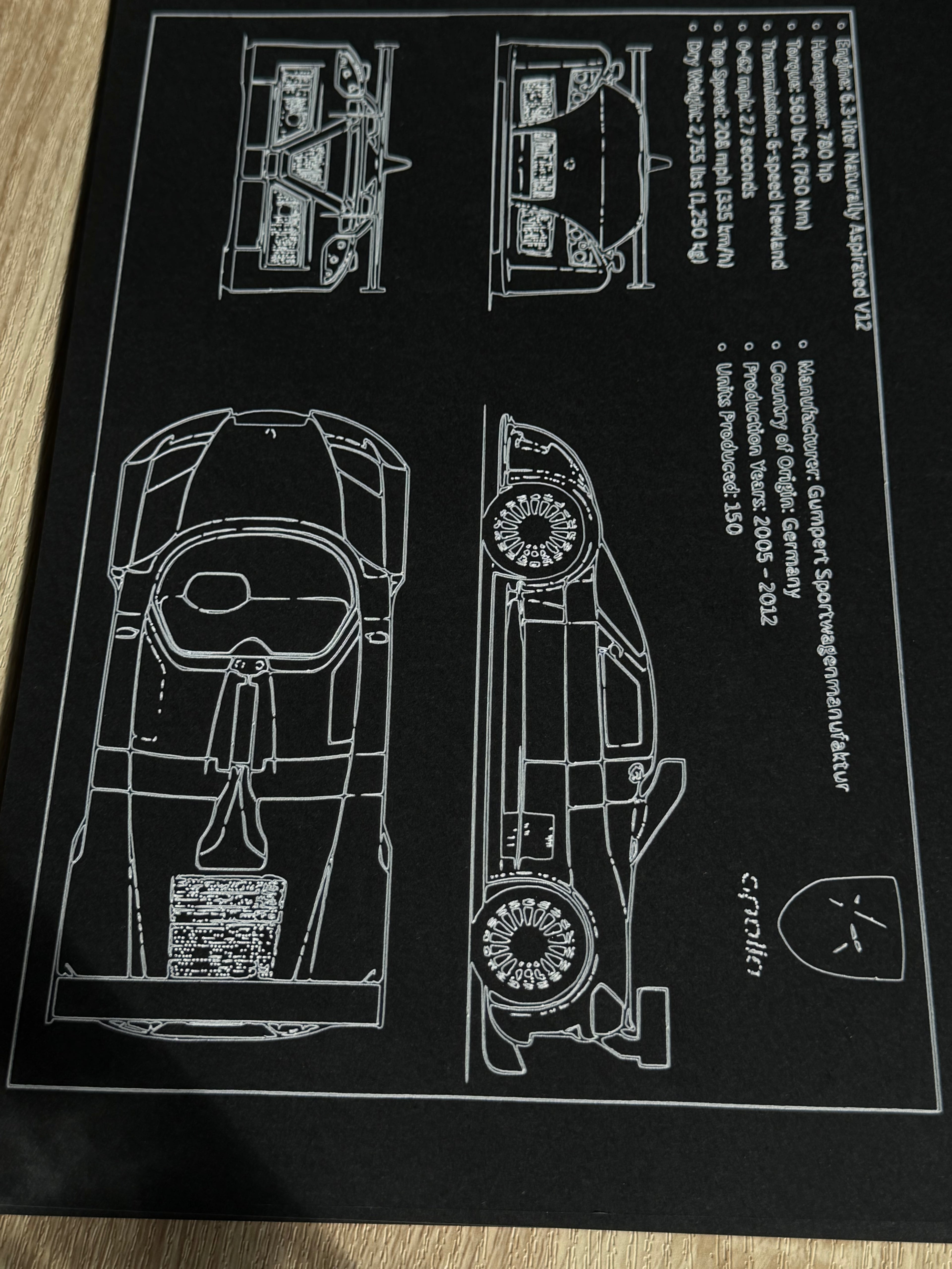 Technical drawings of a vehicle on a black background